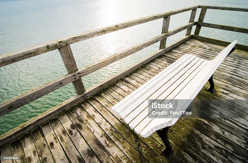 at the lake old wooden bench at a lake Bench Stock Photo