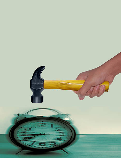 Hammer hitting Alarm Clock work deadline concept, Hammer hitting Alarm Clock smash alarm clock stock pictures, royalty-free photos & images