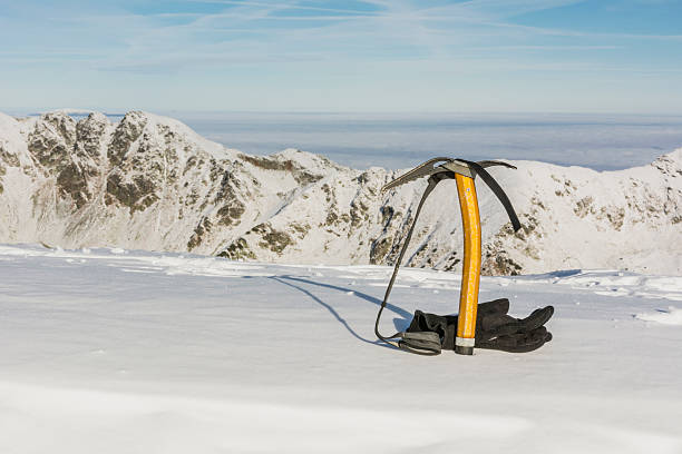 istock Gloves and Ice axe against the ridge 530275737
