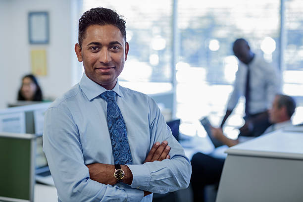 Confident businessman in office stock photo