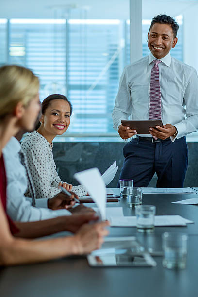 businessman discussing during presentation - indian ethnicity meeting business person business stock-fotos und bilder