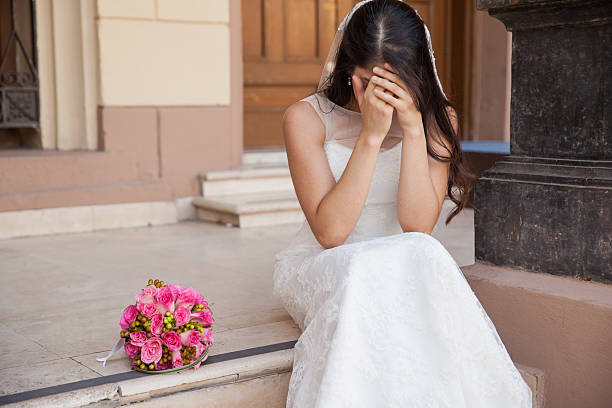 Stood up at the altar Hopeless bride crying outside a church after being stood up on her wedding day crying stock pictures, royalty-free photos & images