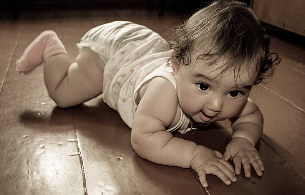 istock baby crawling on the floor 530283627