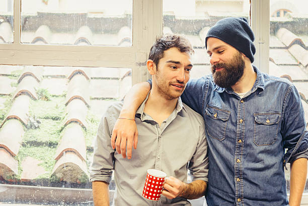 istock Two young friends near a window 530285315