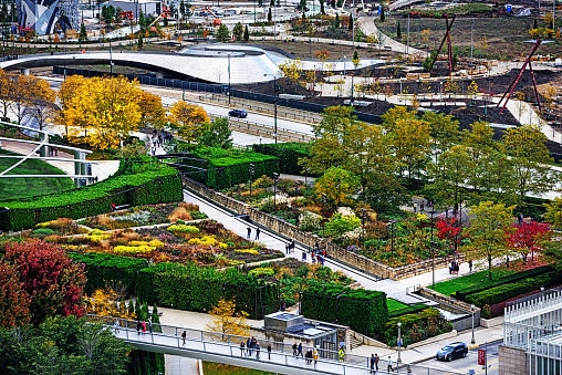 Chicago, USA - October 18, 2014: Lurie Garden in Chicago, viewed from above in the autumn. Many distant people on a wet day.