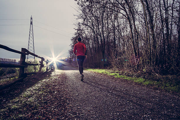 istock Trail running near a river 530287597