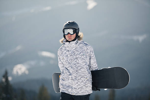 istock snowboarder against sun and sky 530288453