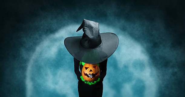 istock Mystery Halloween witch with pumpkin 530288579