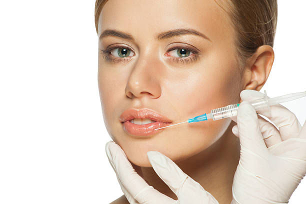 istock Botox injection to the lips 530289475