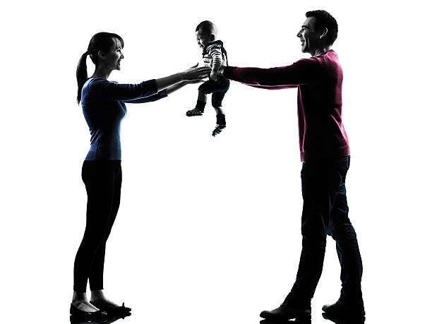 istock parents with baby silhouette 530289531