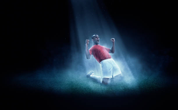 Soccer player winning in spotlight