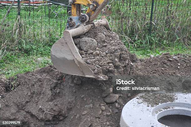 Excavator Digging A Hole Stock Photo - Download Image Now - Backhoe, Building - Activity, Construction Industry