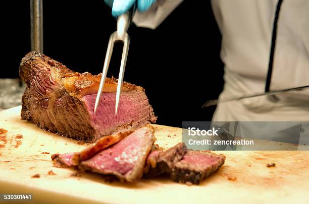 Carving The Prime Rib Steak Stock Photo - Download Image Now - Pot Roast, Roasted, Roasted Prime Rib