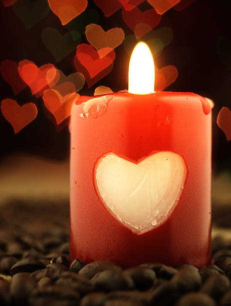 istock Red candle and coffee on the table. Hearts in background. 530301931