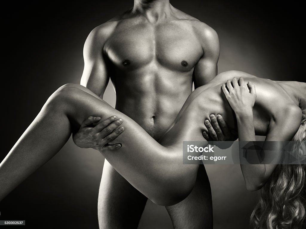 Nude sensual couple Fashion art photo of naked men with woman in his arms Black Color Stock Photo