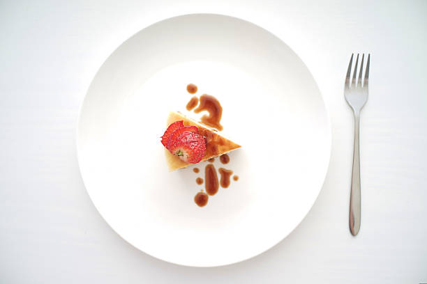 istock Topview of cheesecake on a big plate 530303515