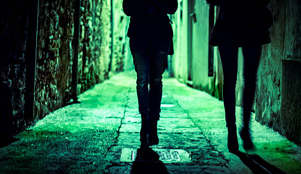 istock Silhouettes on a dark street 530308081