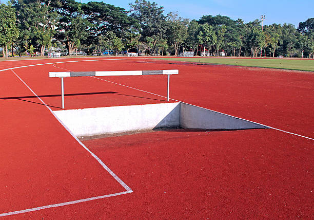istock Hurdles fence on red running tracks 530308127