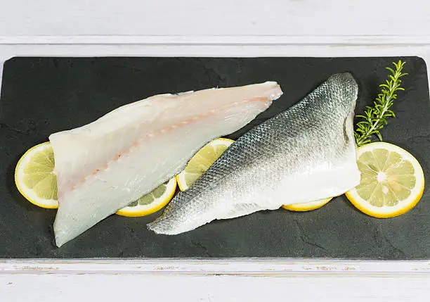Fresh sea bass fillets and cut and clean