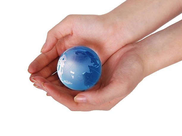 istock glass globe in female hands 530310743