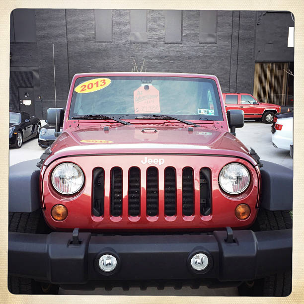 Scottsdale, United States - November 10, 2011: A parked silver 2008 Jeep Wrangler, this particular Jeep has a custom shock kit and winch and is known as the Sahara edition.