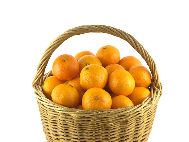 istock Tangerines in brown wicker basket isolated on white 530311531