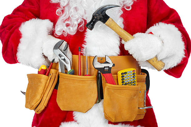 Santa Claus with a tool belt. stock photo