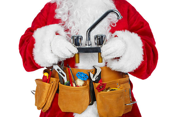 Santa Claus with a tool belt. stock photo