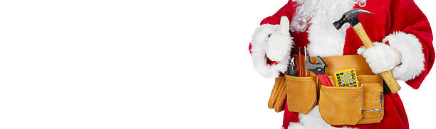 Santa Claus with a tool belt. stock photo