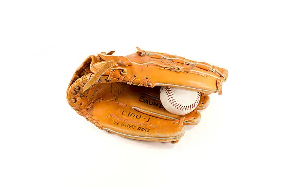 An isolated glove holding a basball  on white.