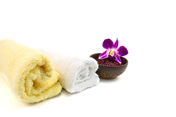 istock Spa and wellness setting with flowers and towel 530323157