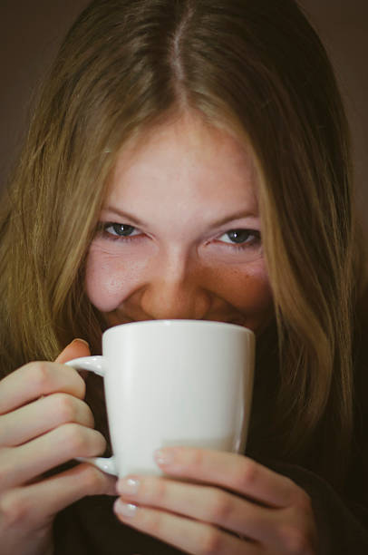 istock Young girl drinking first morning coffee 530323217