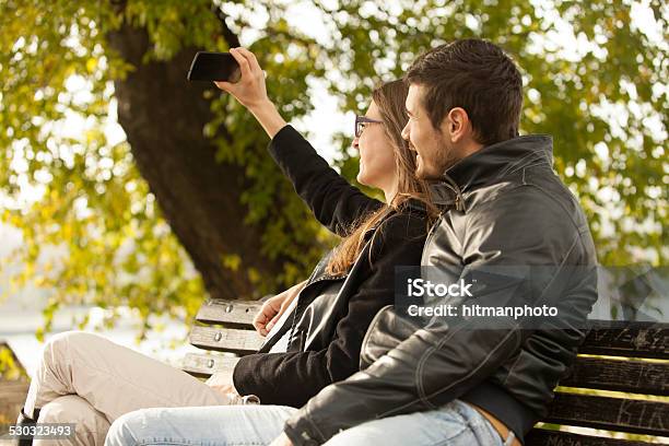 Happy Couple Taking A Selfie Photo Outdoor Stock Photo - Download Image Now - Adult, Adults Only, Autumn