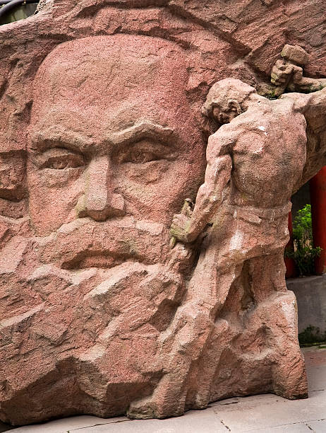 Karl Marx Old Pink Stone Statue, Chongqing, Sichuan China. Old Communist sculpture from Communist era in China
