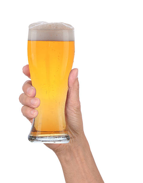 istock Hand Holding Glass of Foamy Beer 530324497