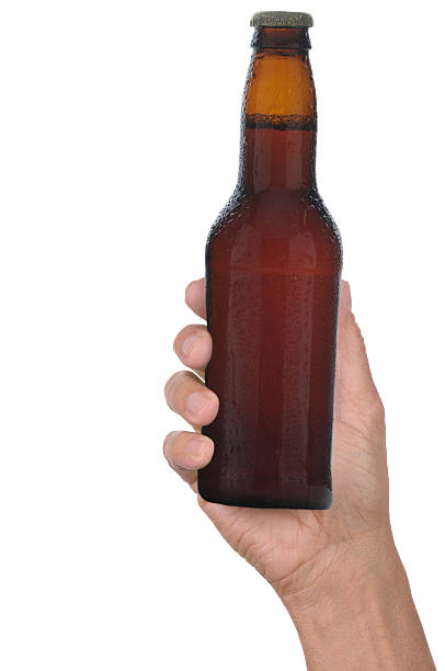 istock Hand Holding Bottle of Beer 530324547