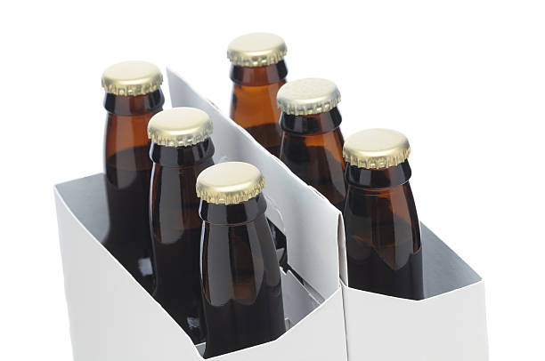 istock Close up of Six Pack with Brown Beer Bottles 530324835