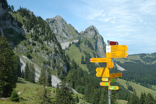 Trail direction signs nearby Grosser Mythen mountain in Alps in Switzerland.
