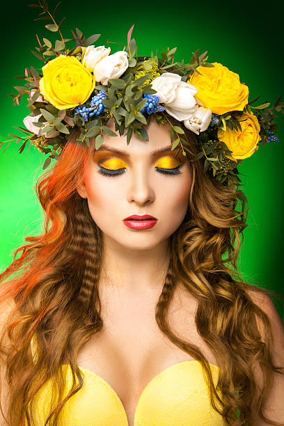 istock Glamour model with wreath on green background 530334445