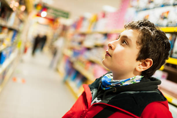 istock Boy in the supermarket 530335207