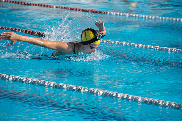 istock Female Swimmer at Butterfly Stroke Wearing Small Camera 530335651