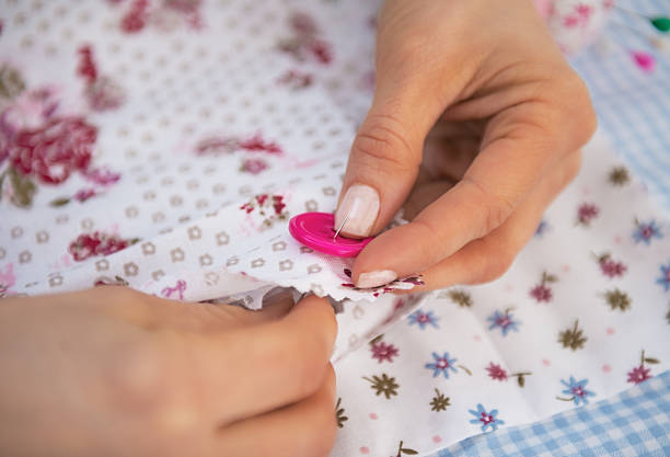 istock closeup on dressmaker woman sewing 530336979