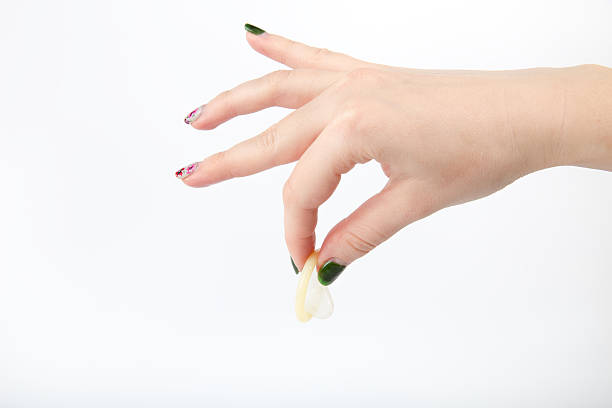 istock fastidiously keep a used condom with two fingers 530336983