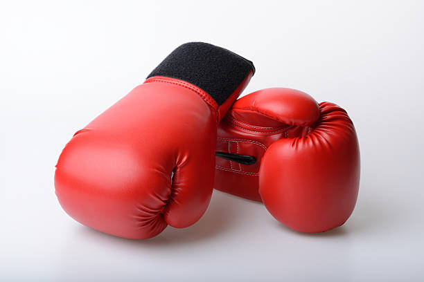 istock Pair of red leather boxing gloves isolated on white 530338813