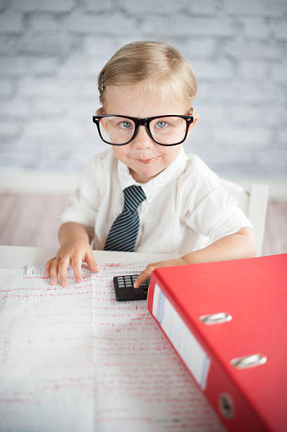 istock Little business person eating chocolate at work 530339477