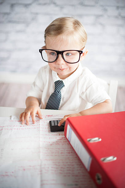 istock Little business person eating chocolate at work 530339485