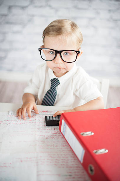 istock Little business person eating chocolate at work 530339501