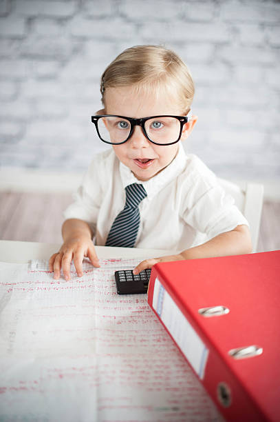istock Little business person eating chocolate at work 530339511