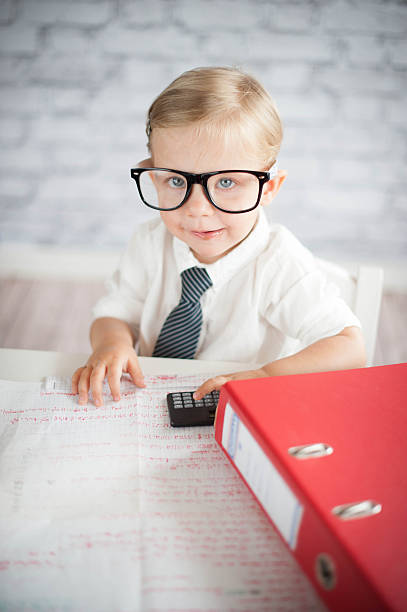 istock Little business person eating chocolate at work 530339515