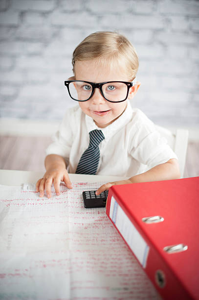 istock Little business person eating chocolate at work 530339857